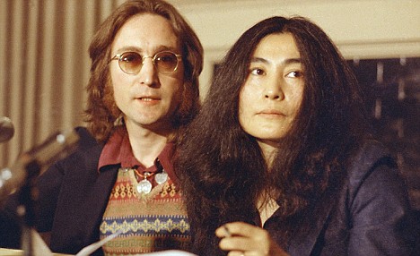Former Beatle John Lennon and his wife, Yoko Ono, speak at a news conference in New York City in 1973